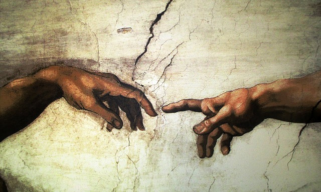 close up of the fingers touching in the Sistine Chapel