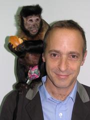 photo of David Sedaris with a monkey on his shoulder