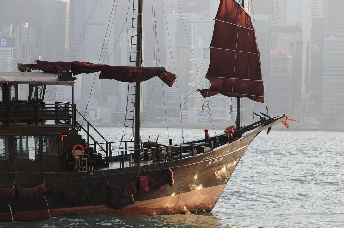 photo of junk boat in Hong Kong harbor